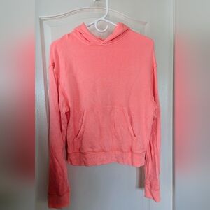SKIMS slightly cropped hoodie, color is coral (pink), size medium